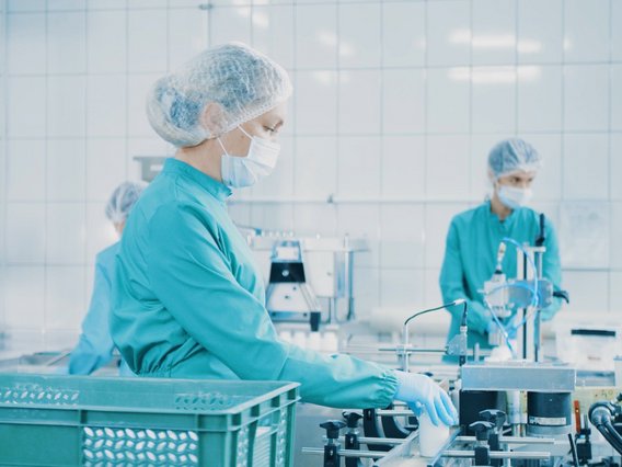 Healthcare staff working on the capsule packaging line Healthcare staff working on the capsule packaging line