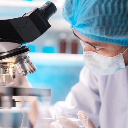 Woman at a microscope
