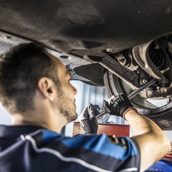 TÜV NORD safety test TÜV NORD tester checks the tyres of a car