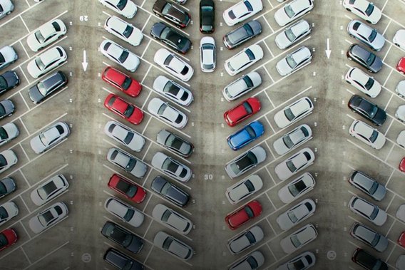 Fleet management Aerial view of a large car park with many cars