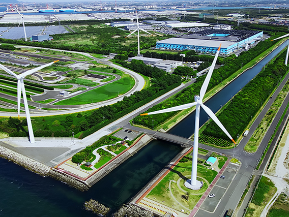 Symbolbild BEHG-Carbon-Leakage-Verordnung Industrieanlage mit Windkrafträdern - Symbolbild BEHG-Carbon-Leakage-Verordnung